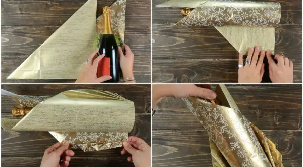 Passaggi per come incartare una bottiglia di vino con carta dorata e fiocchi di neve. La bottiglia viene avvolta e piegata con cura.